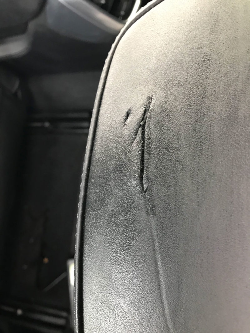 Car headrest damage repaired on Porsche Cayenne Leather Revive